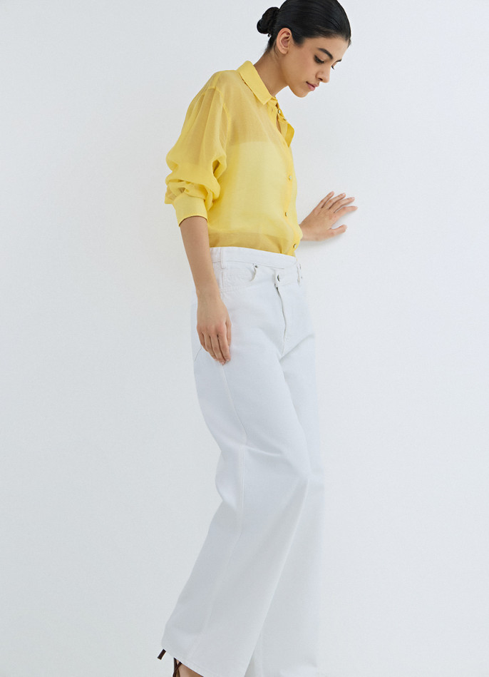 Широкие джинсы с асимметричной застёжкой