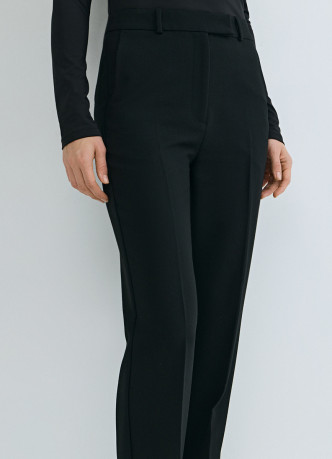 Расширенные книзу брюки