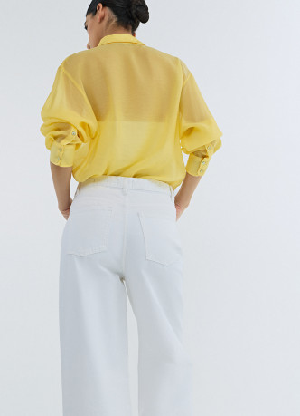 Широкие джинсы с асимметричной застёжкой